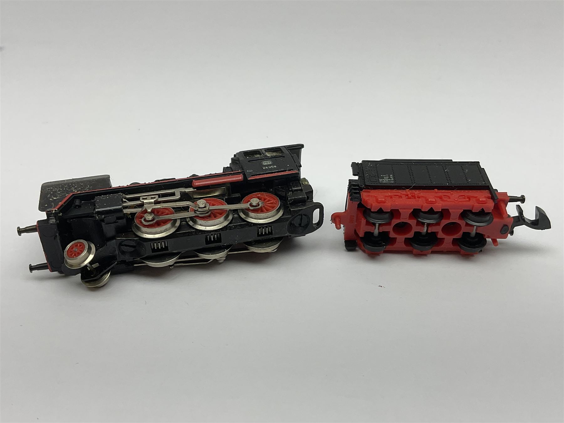 Marklin mini-club 'Z' gauge - DB Diesel Co-Co type locomotive; DB 0-6-0 Rangierlok type shuttle locomotive probably no.8864; and another DB 0-6-0 locomotive probably no.8800; together with an unmarked DB 4-6-2 tender locomotive and DB 2-6-0 tender locomotive; all unboxed (5)