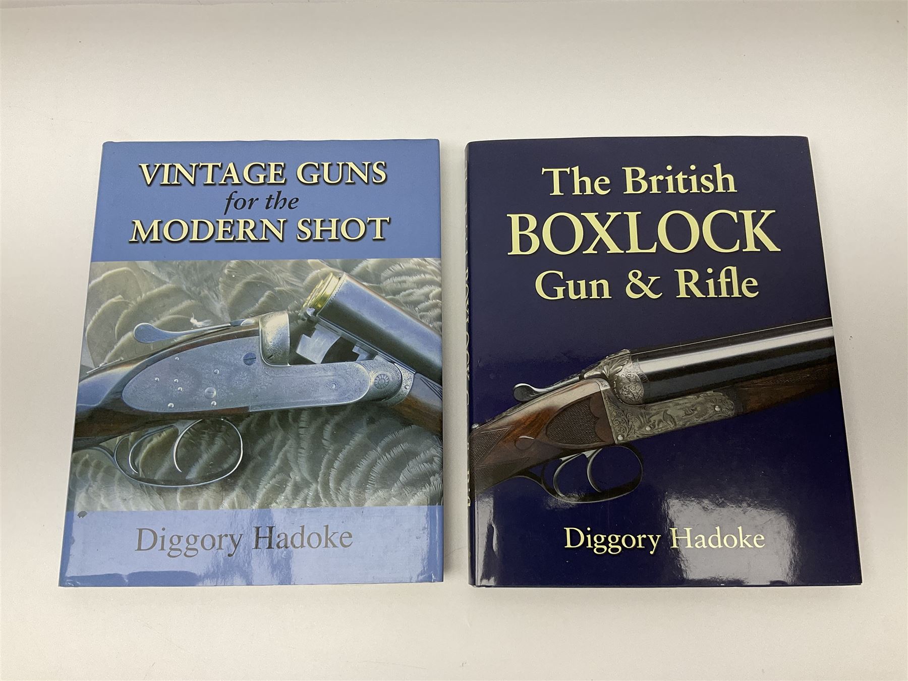 Dallas Donald: Holland & Holland The Royal Gunmaker The Complete History. 2003 Quiller Press; and three other books on guns by Diggory Hadoke - Hammer Guns in Theory and Practice. 2016; Vintage Guns for The Modern Shot. 2007; and The British Boxlock Gun & Rifle. 2012; all with dustjackets (4)