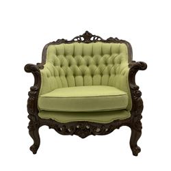 Late 20th century continental baroque three piece lounge suite, carved beech framed, upholstered in buttoned pale green fabric, overall floral and acanthus scroll carved decoration with pierced detail, comprising three seat sofa (W200cm), and a pair of armchairs (W84cm)