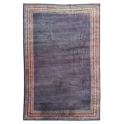 Large North-West Persian Arrak indigo ground carpet, the field decorated all-over with sma...