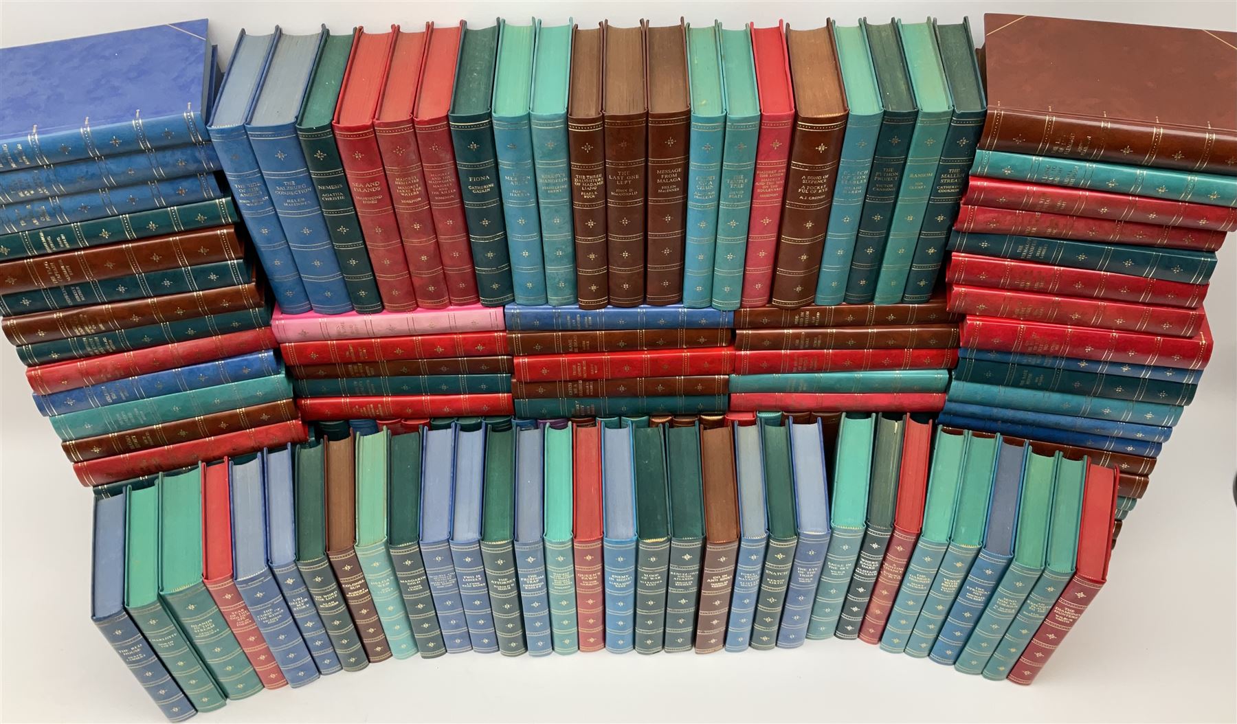 The Companion Book Club London, approximately one hundred thirty hardback novels, various titles including, Blood Sport by Dick Francis, Nemesis by Agatha Christie, The Eye of The Tiger by Wilbur Smith, etc. 