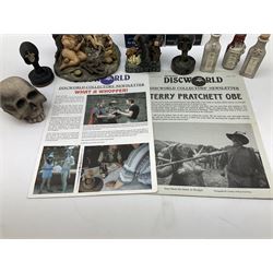 Terry Pratchett Discworld figures, designed by Clarecraft, comprising Cohen the barbarian, DW42, the Patrician, boxed, DW37, three Potions, DW18, DW19, DW20, two Death Bookstamps, DW50, the Gods Dice Box, boxed, DW26, together with two Discworld newsletters, volume 5, August 1998 and volume 6, August 1999. 