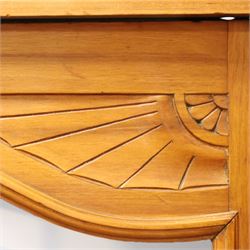 Edwardian walnut triple combination wardrobe, projecting pediment with pierced foliate scroll cresting above a central cupboard flanked by bevelled mirrored doors, over open recess with mirrored back, above two short and three long drawers with brass handles, interior fitted with hanging rails and shelf, raised on plinth base