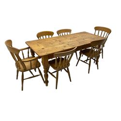 Pine farmhouse dining table, rectangular top with rounded corners, raised on turned supports; together with a set of six (4+2) spindle-back dining chairs