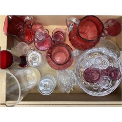 A collection of glass ware, including cranberry glass with a dear etching, collection of  cranberry glass jugs, one with a clear glass stopper, a baluster form decanter with a tear drop stopper, seven glass bowls etc, four boxes. 