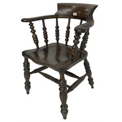 Early 20th century stained beech captains smokers bow chair, spindle tub shaped back over saddle seat, raised on turned supports united by double H-stretcher