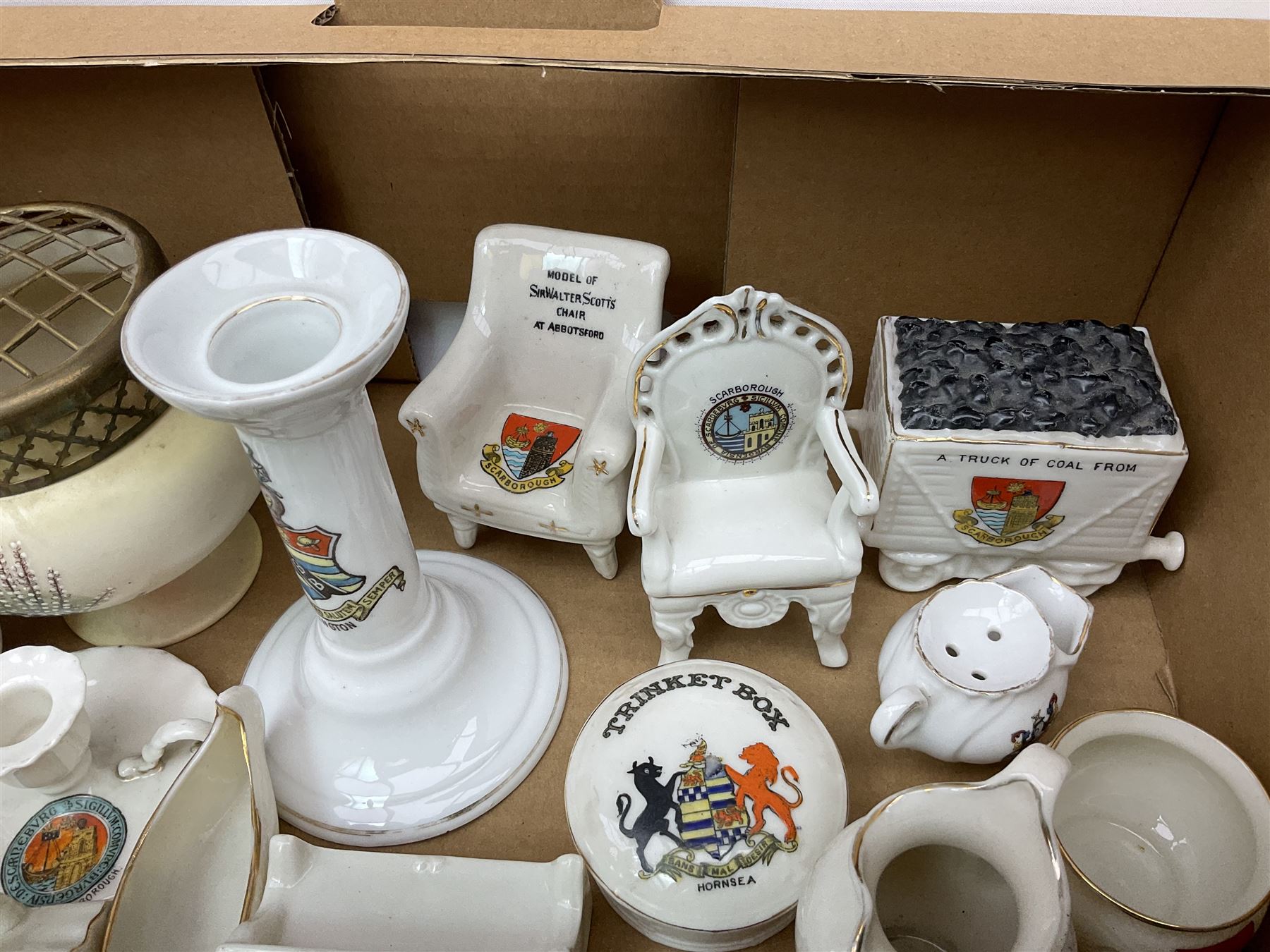 Collection of crested ware, to include Scarborough Willow Art coal truck, Whitby Willow Art Burns and Highland Mary figure group, Carlton China beer drinker 'Tak Hod an Sup Lad', and 'Here's ta me an'ma wife's usban', lighthouse, boat, Kingsway Art China Sir Walter Scott's Chair, butter dishes, candlestick, pianos etc