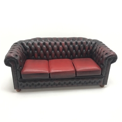  Three seat Chesterfield sofa, upholstered in deep buttoned oxblood leather, W194cm  