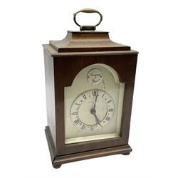 Georgian style mahogany cased bracket type clock retailed by Henry Lee & Sons Hull, with brass carrying handle to the pagoda top, arched silvered dial with Tempus Fugit plaque, raised chapter ring with Roman numerals enclosing French brass eight day movement with integral key, on bun feet, H24cm  