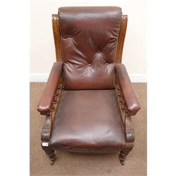  Late Victorian oak framed gentleman's armchair, upholstered in a maroon leather, turned tapering supports, W69cm  