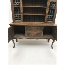 Early 20th century oak dresser, raised three tier plate rack flanked by lead glazed display cabinets above two drawers and two cupboards, cabriole legs, W157cm, H197cm, D50cm
