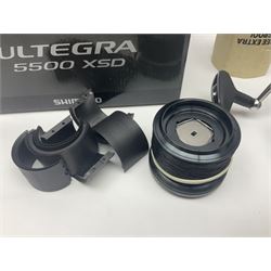 Four fixed spool reels, all in original boxes, comprising Shimano Ultegra 5500 XSD, with spare spool, Mitchell Autosurf 700, with spare spool, Shimano Sedona 600 FB with spare spool and D.A.M Quick 5001
