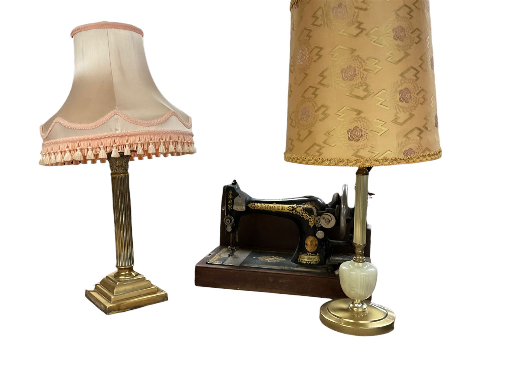 Cased Singer sewing machine, with two table lamps including a brass corinthian column example