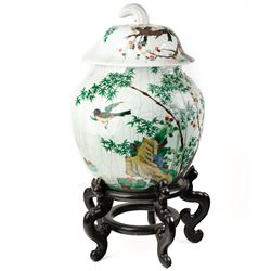 Late 19th century Chinese famille verte crackled ice pot and cover, of ovoid form, decorated with birds, blossom and bamboo, the cover with handle formed as a root, with hardwood display stand H50cm
