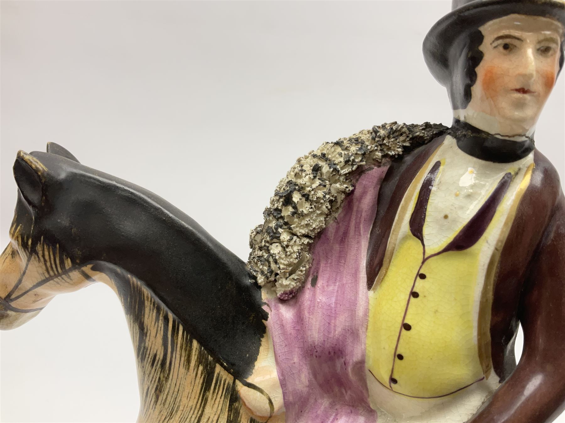 19th century Staffordshire figure of Robert Peel, titled 'Sir Robert Peel', modelled on horseback, atop an oval plinth base featuring a naturalistic and floral design, H30cm 