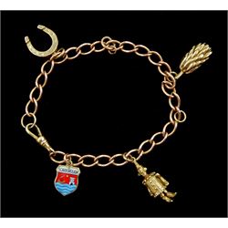 9ct rose gold curb link charm bracelet with yellow gold clip and four 9ct gold charms including, horseshoe, clown, bananas and enamel Scarborough charm
