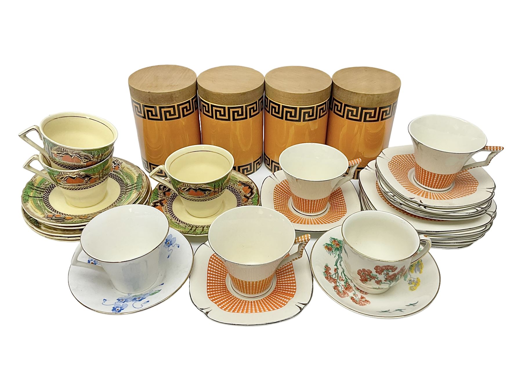 Four Portmeirion storage jars with Greek key pattern on an orange ground, together with Tams Ware tea service and other ceramics