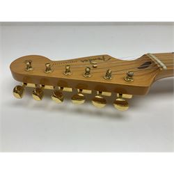 Fender Stratocaster 50th Anniversary 2004 metallic gold electric guitar; serial no.MZ4116369; L98cm; in Spider fitted case with owners manual and other paperwork, strap and belt buckle etc