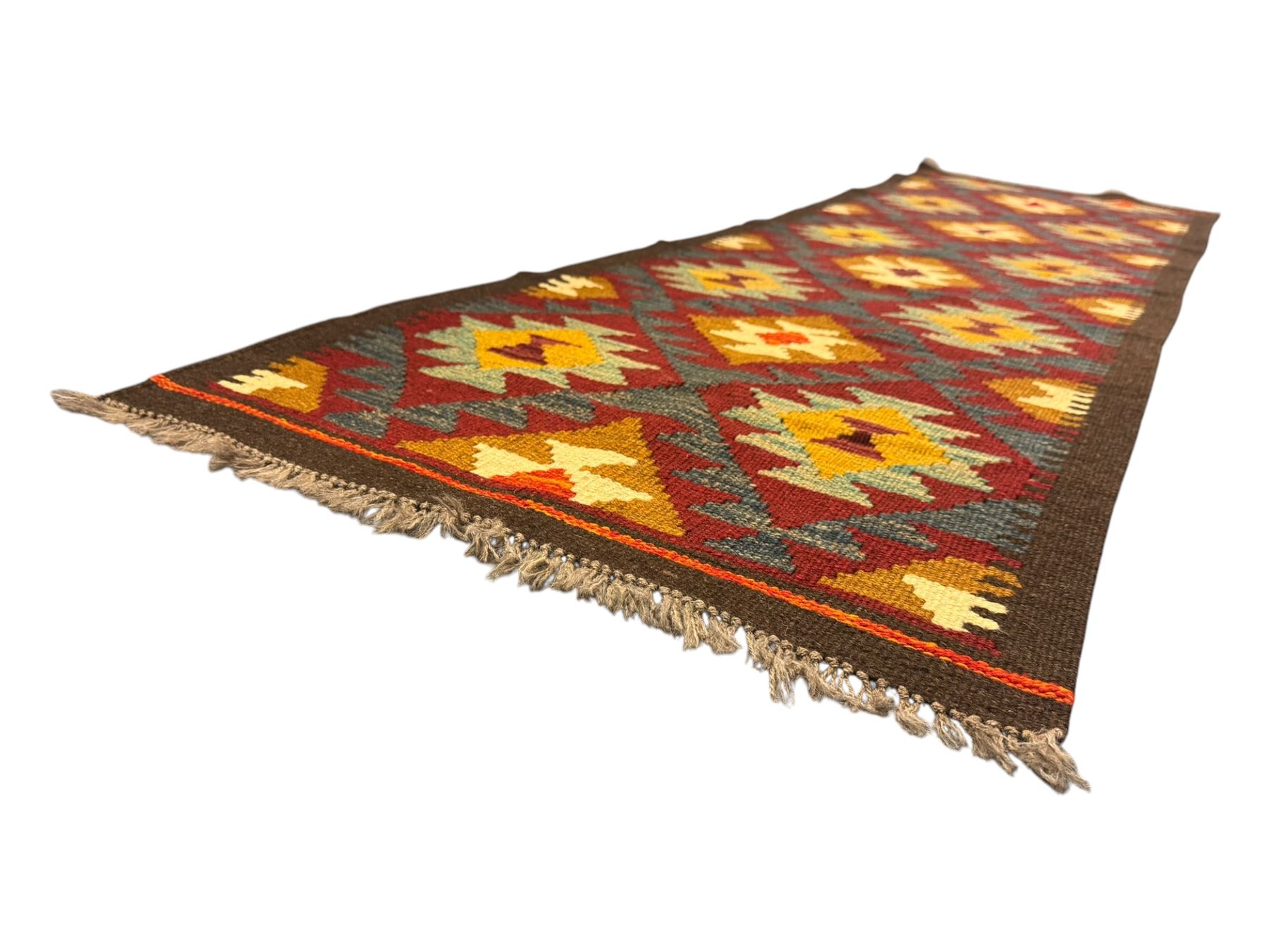 Maimana Kilim ground runner, multicoloured geometric medallions arranged in rows, with triangular motifs in the field, the wide border in brown with contrasting guard bands