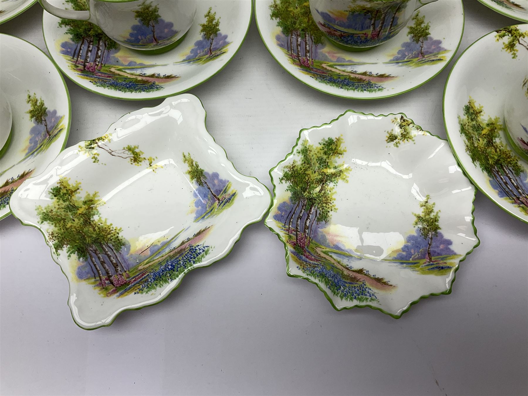 Aynsley Bluebell Time 'As Supplied to the Queen' tea service, comprising hot water jug, six teacups and saucers, milk jug, two cake plates and tow trinket dishes  