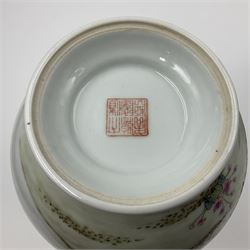 Pair of Chinese Republic porcelain vases, each painted in Famille Rose enamels with pairs of pigeons amidst peony, rock, flowering plants and leafy branches, possibly Qianlong seal beneath, H22cm 