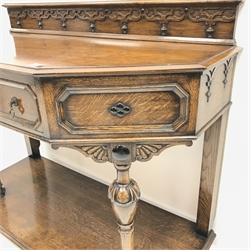 Early 20th century oak side table raised back, shaped front, single drawer, turned supports joined by single undertier, W107cm, H88cm, D48cm