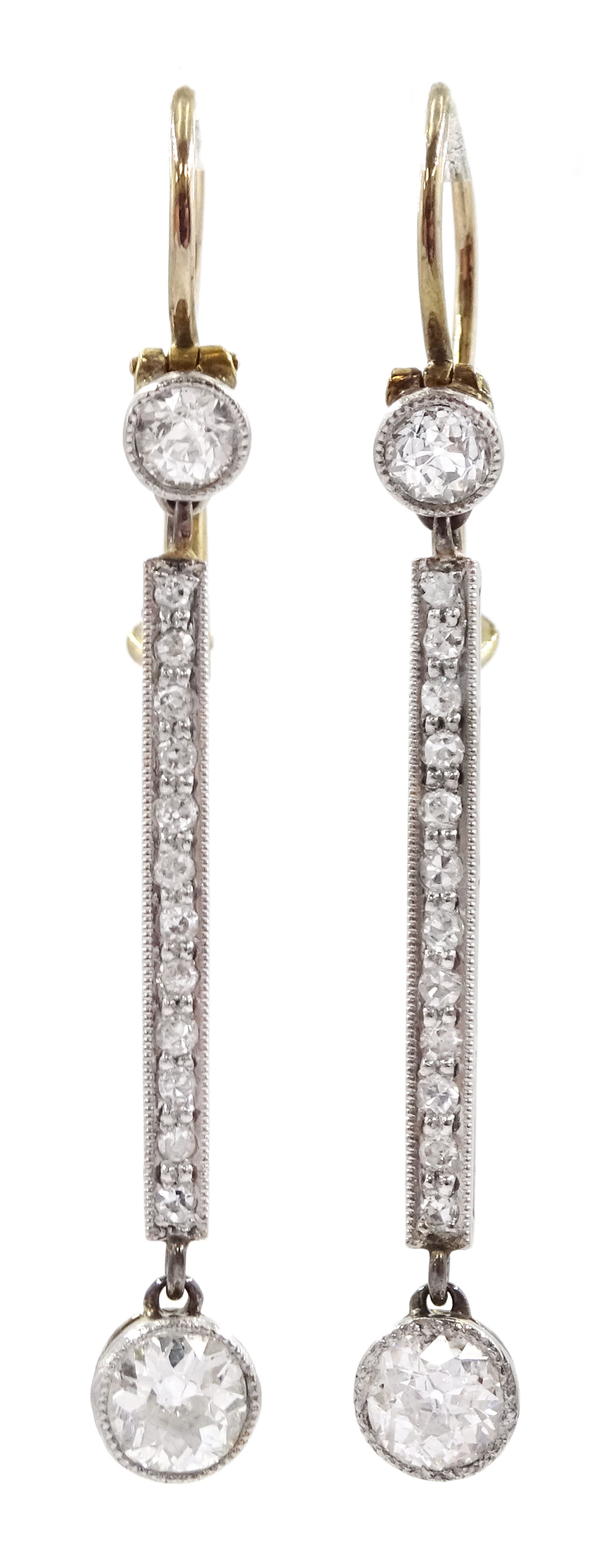 Pair of Art Deco platinum and gold, milgrain set old cut diamond pendant stud earrings, total diamond weight approx 0.70 carat
