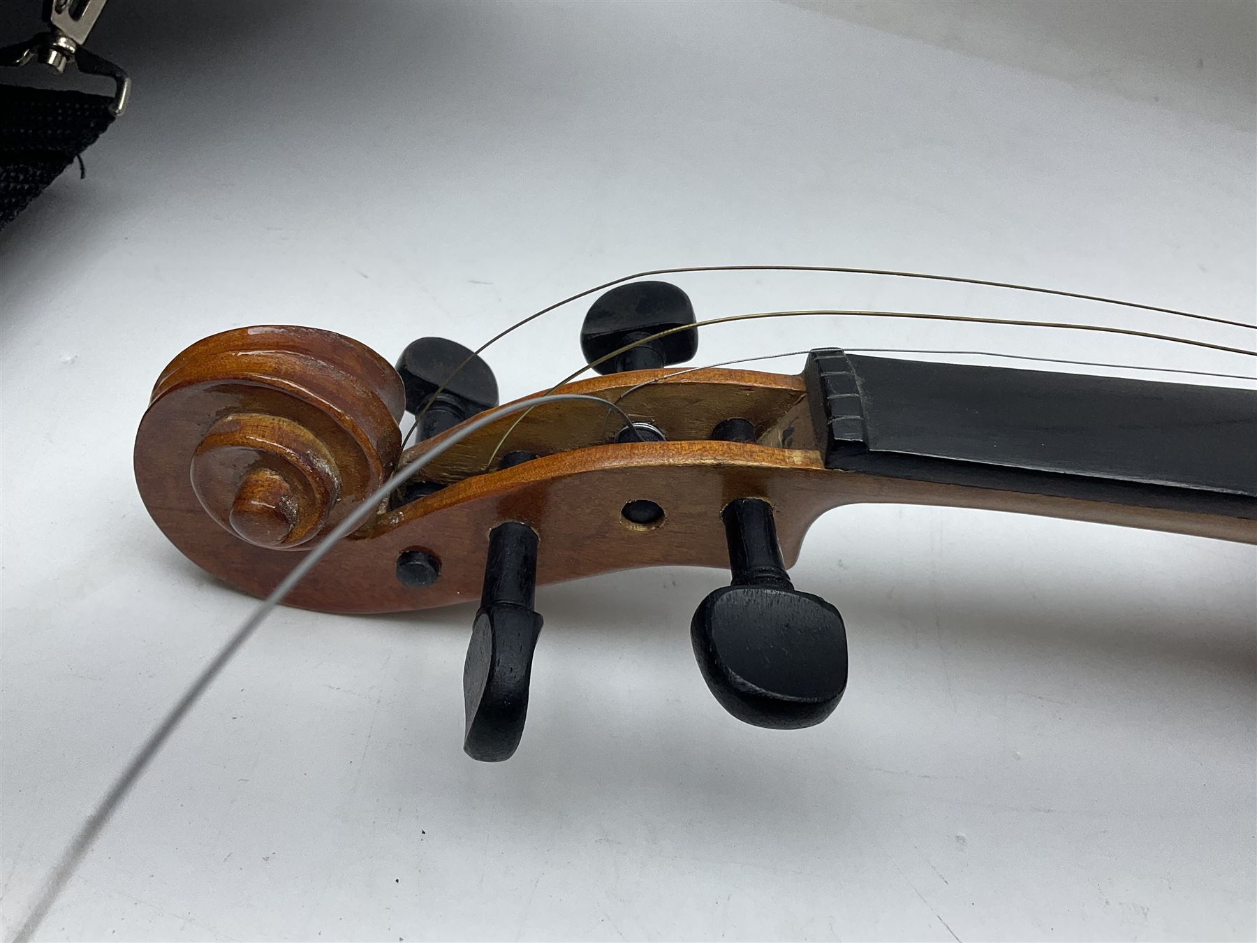 Four student violins - two Chinese three-quarter size with 33.5cm and 34cm two-piece backs; Stringers of Edinburgh quarter size with 28cm two-piece back; and Stentor quarter size with 28cm two-piece back; each in carrying case (4)