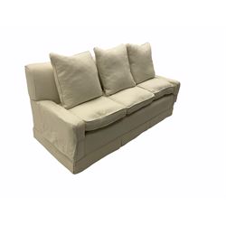Three seat sofa upholstered in natural white linen, feather cushions
