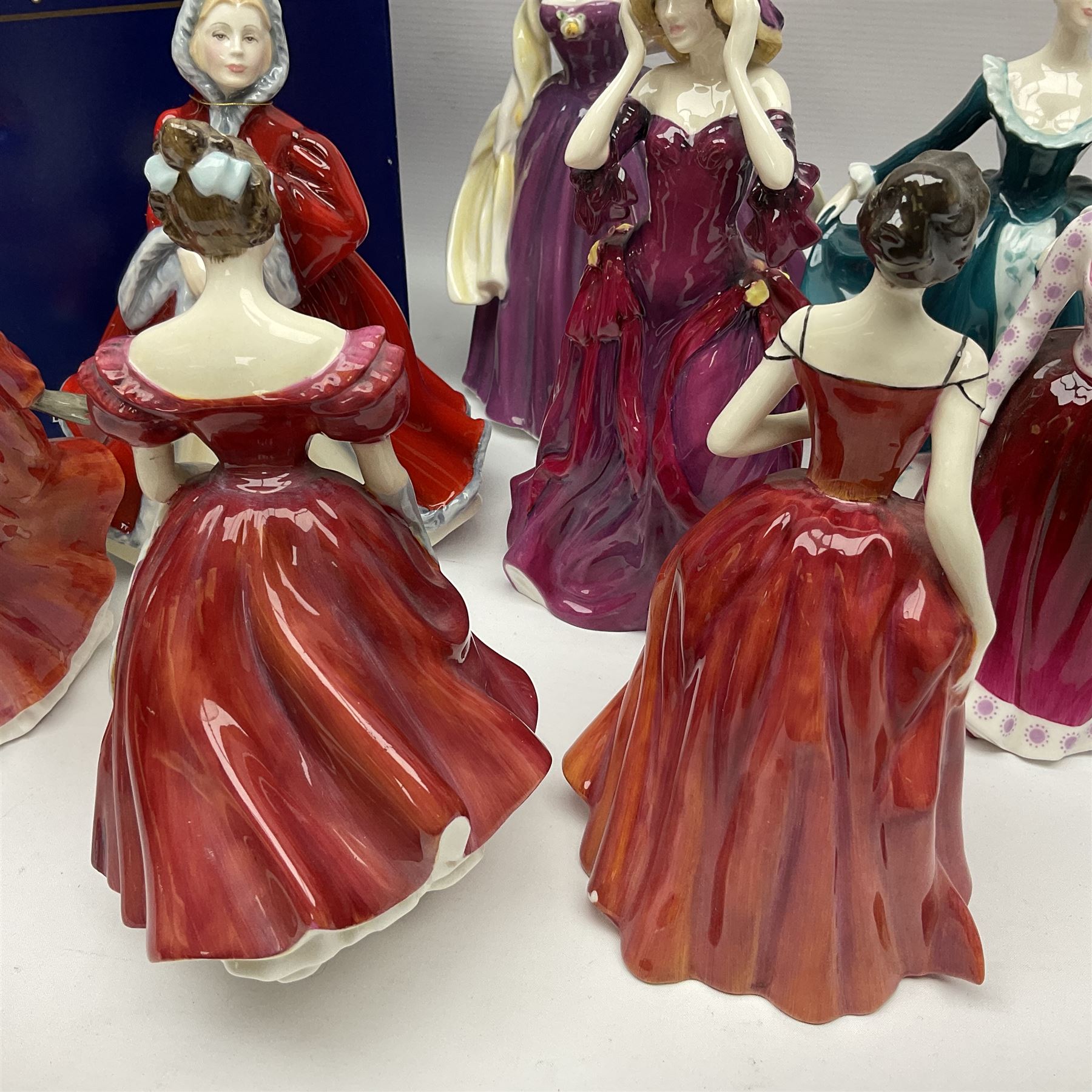 Eight Royal Doulton figures, comprising Rachel HN2936, The Skater HN3439, Janine HN2461, Innocence HN2842, Special Celebration HN4234, Autumn HN4272, Fiona HN2694 and Winsome HN2220, together with three smaller Royal Doulton figures My First Figurine HN3424, Buttercup HN3268 and Autumn Breezes HN2176