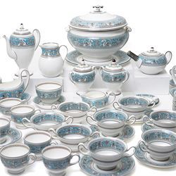 Wedgwood turquoise Florentine part service, comprising large covered tureen and stand, coffee pot, teapot, two covered sucriers, milk jug, two sauce boats and stands, seven soup plates, three bowls, jug, eighteen soup bowls and fifteen stands, two ashtrays, thirteen further saucers, twelve teacups and eleven saucers, and twenty-one further plates of varying sizes