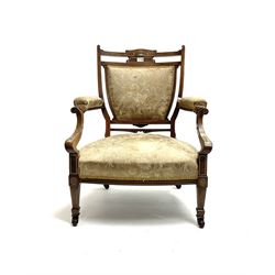 Edwardian inlaid rosewood salon chair, upholstered in floral pattern fabric, square tapering supports with brass and ceramic castors