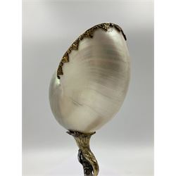 Modern limited edition silver mounted nautilus shell cup, no. 42/150, the pearlescent shell cup with silver-gilt strapwork to rim, upon a stem modelled as a putto supporting a gilt cornucopia and circular domed foot depicting Poseidon amongst swirling waves, hallmarked by St James House Company, London 1980,  H17.5cm
