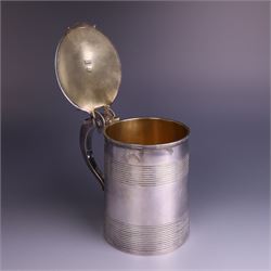 George III silver lidded tankard, with two ribbed bands to the cylindrical body, the hinged lid with concentric circle to cover and pierced thumbpiece, hallmarked Charles Fox I, London 1816, including thumb piece H16cm