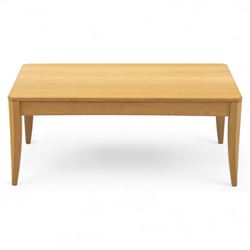 Ercol - light oak ‘Artisan’ coffee table, of rectangular form with chamfered top and gentl...