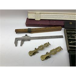 Two Victorian brass sovereign scales, one marked 'Harrison' L10cm; cased set of drawing instruments by G. Thornton Limited Manchester; Chesterman No.770/1 steel vernier caliper; two boxwood rulers; cased slide rule; brass and boxwood rope/wire gauge etc