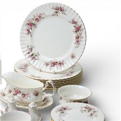 Royal Albert Lavender Rose tea and dinner wares, comprising eight dinner plates, and eight small dinner plates, eight side plates, open serving dish, teapot, open sucrier, salt and pepper, sandwich plate, sauce boat and saucer, eight teacups and saucers, six bowls, six oval serving dishes, and one platter