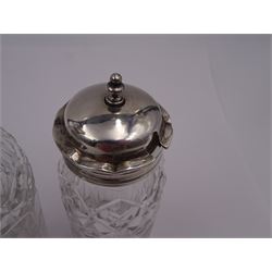 Late 18th century silver cruet stand, of oval form, with pierced sides upon four bun feet, hallmarked to handle Hester Bateman, all other hallmarks indistinct, together with five matched silver mounted cut glass cruet bottles, including some later Victorian examples, hallmarks predominantly indistinct, stand H20cm