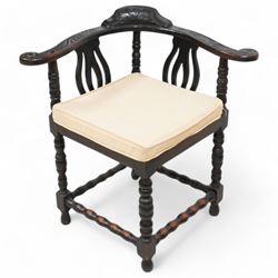 Victorian carved oak corner chair, shaped arms carved with trailing leafy branches, pierced splats over panelled seat, on bobbin turned supports and stretcher