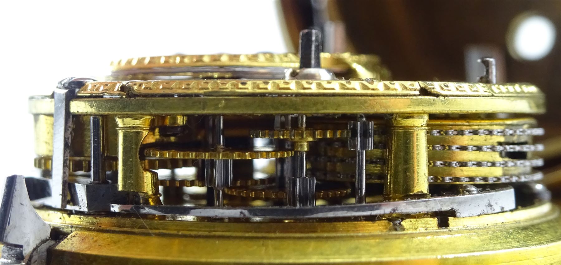 18th century gilt pair case quarter repeating cylinder fusee pocket watch by Matthew Hill (London 1744-ca.1790), No. 417, round pillars, pierced and engraved balance cock with diamond endstone, white enamel dial with Roman numerals, plunge repeat in the pendant, bull's eye glass, the outer case engraved with initials and bird with inscription 'Hazard Zit Forward'