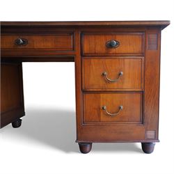 And So To Bed - French cherry wood twin pedestal dressing table, the rectangular top over seven drawers arranged with a central drawer and three drawers to each pedestal, panelled sides with louvred detail, raised on turned bun feet