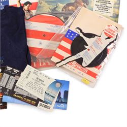 Collection of 1980s and later music tour merchandise and records, including Dire Straits Love Over Gold t-shirt, U2 Zooropa t-shirt, Bruce Springsteen Born In The USA tour programme, Bruce Springsteen Cover Me Stand Up picture disc and sleeve, Bruce Springsteen Born In The USA picture disc, Bruce Springsteen Western Stars limited edition coloured vinyl, Depeche Mode Singles Tour programme 1986-88, Journey 1986 programme and ticket stub, Journey Eclipse Collectors Edition Set and 2017 Download Festival passes