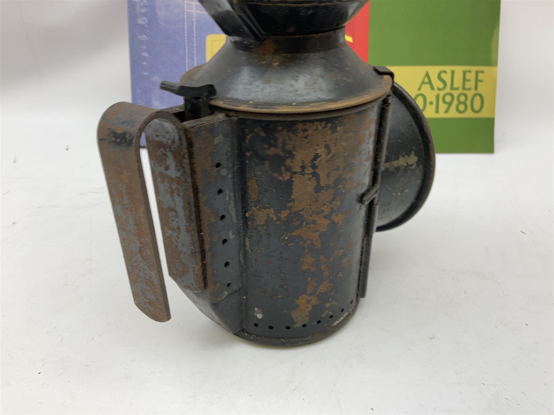 Black painted three colour railway lamp with revolving filters, H29cm; BR Acme Thunderer whistle; three railway peaked caps, two with BR Intercity 125 badge; small album of photographs of railway interest etc