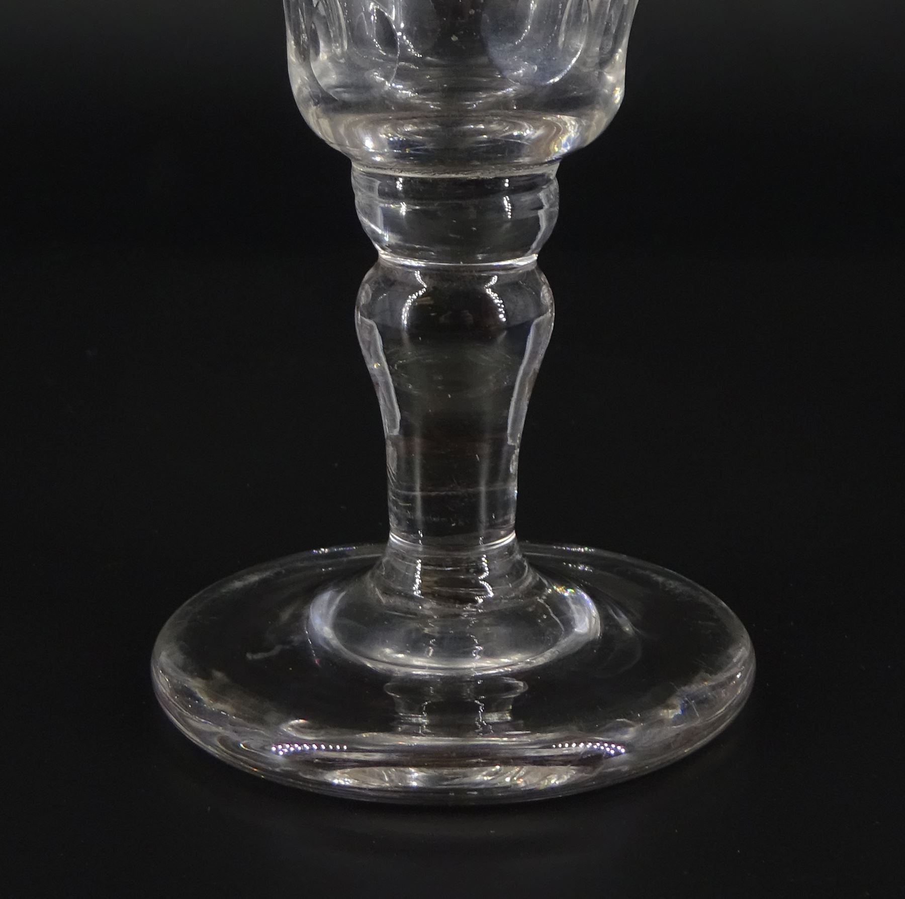 Large 19th century firing glass, the funnel bowl upon thick firing foot, H11cm, together with a further 19th century drinking glass, the funnel bowl cut with circles, upon a baluster stem and firing type foot, H11cm, and a 19th century dwarf ale glass upon a firing type foot, H13cm 