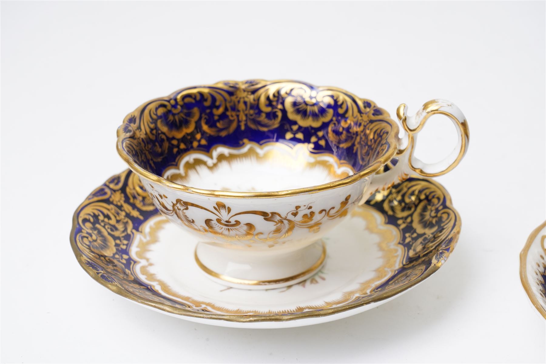 Grainger Lee & Co Worcester teacup, together with a collection of cobalt blue cabinet cups and saucers,  including a Royal Doulton hand-painted example by E Percy, and various others 19th century and later, mostly unmarked (7 pairs)