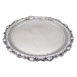 Edwardian silver waiter, of circular form with pierced gallery and shaped rim detailed with flower heads and C scrolls, hallmarked S Glass, Birmingham 1902, D22cm, approximate weight 9.50 ozt (295.7 grams)