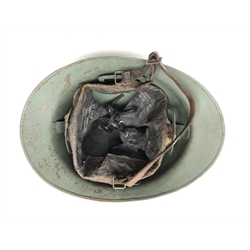  WW2 French Infantry green painted steel helmet, with DP and grenade crest, adjustable leather interior and chinstrap, L31cm  