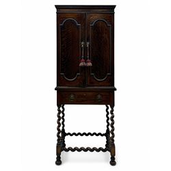 Early 20th century oak two-door cabinet, with single drawer, interior with four fixed shel...