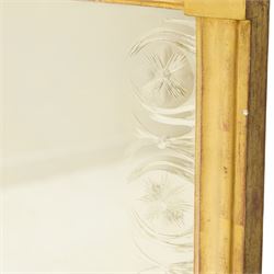 Regency style giltwood and composition tripartite overmantel mirror, rectangular frame with stepped cornice above a pierced geometric frieze, central mirror plate flanked by narrow etched floral side plates, with applied rosette paterae and moulded borders