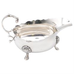 Group of silver, comprising 1930s five bar toast rack, hallmarked B & W Ltd, Birmingham 1931, three piece Edwardian silver cruet set comprising two open salts and a pepper shaker, hallmarked E J Trevitt & Sons, Chester 1904 and a small 1930s silver sauce boat, hallmarked Edward Barnard & Sons Ltd, London 1937 